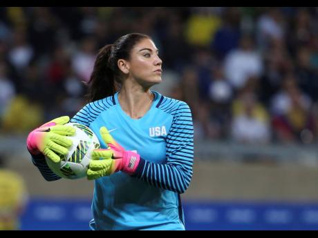 
FILE – United States’ goalkeeper Hope Solo takes the ball during a women’s soccer game at the Rio Olympics against New Zealand in Belo Horizonte, Brazil, August 3, 2016. Former US women’s national team star goalkeeper Solo was arrested after polic