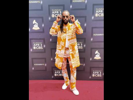 Best Reggae Album nominee, Jesse Royal, stepped on the Grammy Awards red carpet in this eye-catching outfit from Tribe Nine Studios.