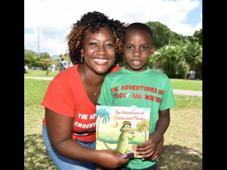 Young author Liam Cousins poses with mother La-Toya Samuels-Cousins at his book launch on the weekend.
