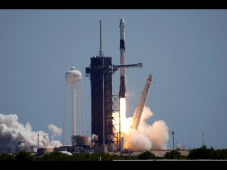 
A SpaceX Falcon 9 rocket with the Crew Dragon capsule attached, lifts off with the first private crew from Launch Complex 39A on Friday, April 8, 2022, at the Kennedy Space Center in Cape Canaveral, Florida.