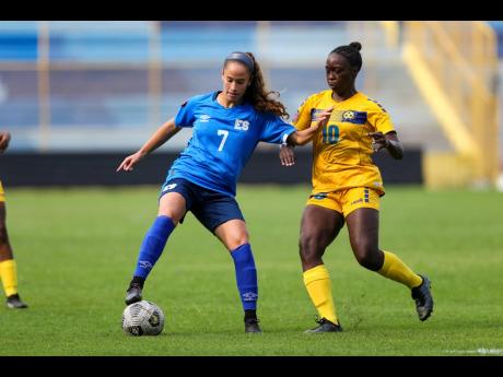 
Salvador’s Danielle Fuentes shields the ball away from a Barbados player during action from the 2022 Concacaf Women’s World Cup qualifiers at the Cuscatlán stadium in San Salvador, El Salvador.