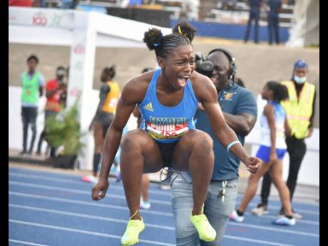 
Oneka Wilson celebrates breaking the Class One 100-metre hurdles ISSA/GraceKennedy Boys and Girls’ Championships record inside the National Stadium yesterday.