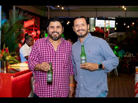 Celebration Brands’ Rogelio Valencia (left), sales director, and Juan Bolivar, managing director, were snapped enjoying ice-cold bottles of Heineken.