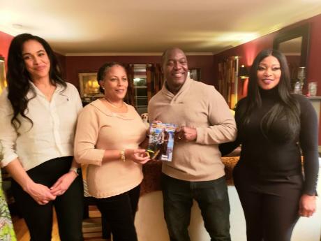 Olympic bobsledder Devon Harris (second right) presents a copy of his motivational book to Ardenne’s principal Nadine Molloy (second left). Sharing in the moment are (from left), Dr Tabina Adam, principal of Gordon Parks Academy in East Orange, New Jerse