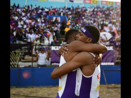 Kingston Colleges Jadan Campbell (left) celebrates winning the Class Two boys’ 110-metre hurdles with teammate Kahiem Carby at the ISSA/GraceKennedy Boys and Girls’ Athletics Championships. 