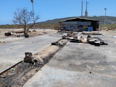 left: The foundation is all that remains after several small restaurants, shops and bars, which sold various fish and seafood meals and liquor and doubled as a hangout spot for customers waiting for their raw fish to be scaled after purchase at the New For