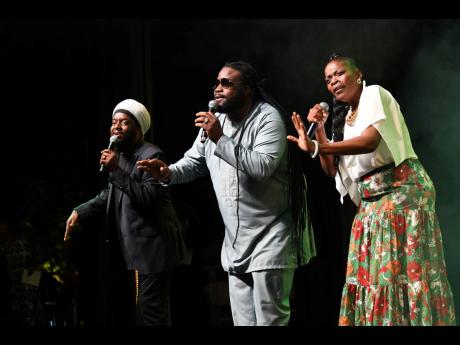 From left: Peetah, Gramps and Una Morgan of Morgan Heritage entertain guests at the launch of Jamaica 60 on the lawns of Jamaica House last Wednesday.