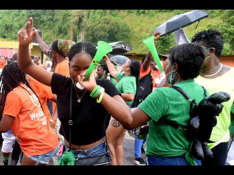 Supporters of the Jamaica Labour Party and People's National Party in a festive mood outside the Mannings Hill Primary School in St Andrew West Rural on September 3, 2020.
