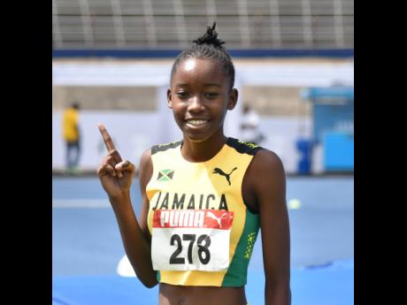 
Jamaica’s Danielle Noble is all smiles after winning the girls’ under-17 high jump gold medal at the Carifta Games inside the National Stadium yesterday.