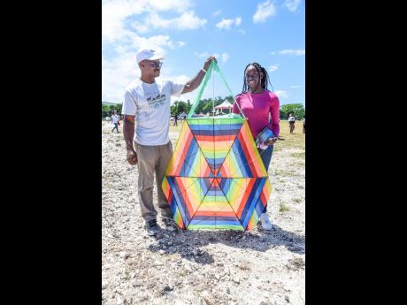 Sukenaya Beckford (right), previous winner of the most beautiful kite, came with her father, Veron Beckford to the kite festival at The Buccaneer’s Jerk and Juice Lawn in St Mary on Sunday.