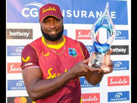 West Indies ODI Captain Kieron Pollard shows off the trophy after his side completes a three-nil series win over Sri Lanka in Antigua.