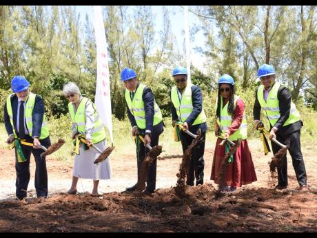 Prime Minister Andrew Holness (third left) joins Carmen Riu (second left), CEO of the RIU hotel chain, and Alejandro Sanchez (left), operations director for Jamaica, The Bahamas and United States, in breaking ground for RIU Aquarelle in Coopers Pen, Trelaw