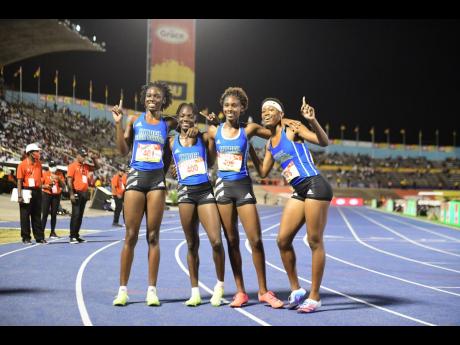 
Hydel High School’s 4x400-metre relay team celebrates winning the event at the ISSA/GraceKennedy Boys’ and Girls’ Athletics Championships inside the National Stadium recently. 