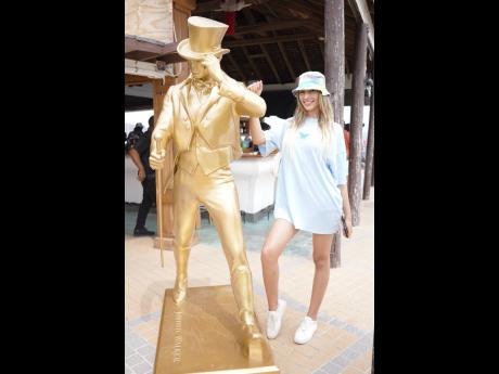 Model Lilith Cabrera struck a pose with the Johnnie Walker Striding Man statue.