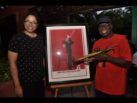 Gay Magnus (left) band master at the Alpha School of Music and Winston ‘Sparrow’ Martin, veteran musician and former band master are all smiles while at the anniversary celebration at the Colm Delves Music Centre in Kingston last Saturday.