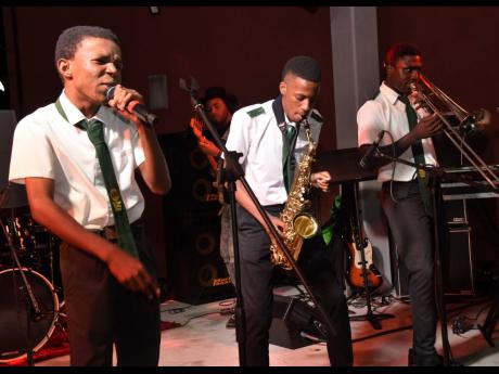 Members of the Alpha Vocation Band performing during the Digicel Business hosting of the first anniversary of the Colm Delves Music Centre in Kingston on Saturday.