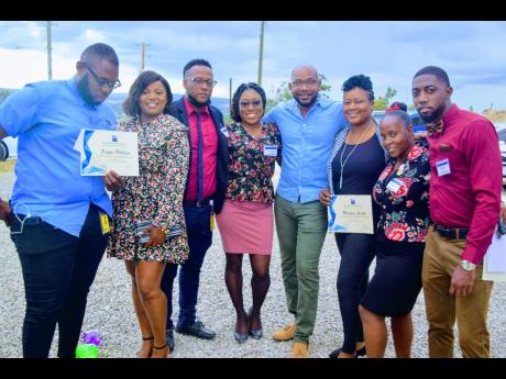 Some of the 26 staffers recognised for their contribution to the non-revenue water- reduction programme in Portmore, St Catherine. From left are Onique Phillips, Mareica Samuels-Clark, Brandon Mitchell, Faithlyn McCalla, Dameon Schroeter, Shevernees Enneve