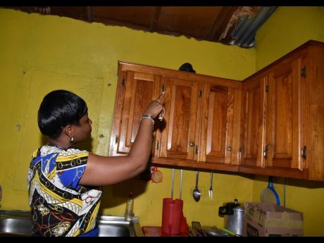 Principal of St Thomas Hill View Kinder and Prep, Kennesia McLean, points to a damaged ceiling which is among the infrastructural deficits with which the school grapples. 
