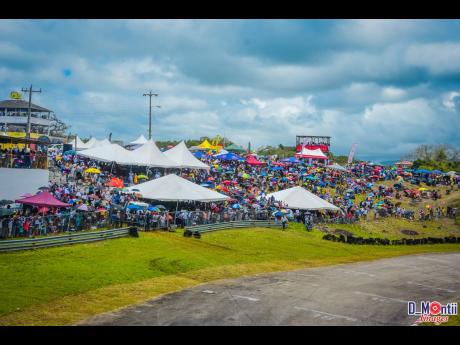The spectators tolerated the sun and threat of showers to cheer on their favourite racers.