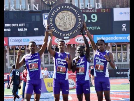 
The Kingston College 4x400-metre relay team celebrate winning the Championship of America event at the Penn Relays yesterday.