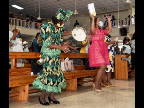 Dr Kasan Troupe, acting chief education officer, dancing during a praise and worship session during the Child Month service held at Eastwood Park New Testament Church of God in St Andrew on Sunday.