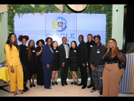 JN Circle members in the UK take a group photo at the official launch recently. Sharing in the moment are Horace Hines (sixth from right), general manager of JN Money Services; Paulette Simpson (fifth from left), deputy chief executive officer, JN Bank UK;