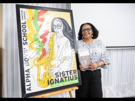 
Poet Laureate of Jamaica Lorna Goodison hands over ‘Mother Muse’ at the Alpha Institute in December 2021.  A number of poems from the publication were about Sister Ignatius.