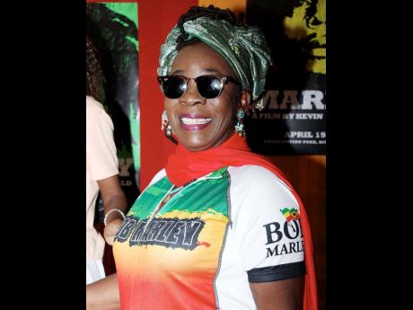 A radiant Rita Marley sports a promotional Bob Marley shirt during a press briefing at the Pegasus Hotel to deliver details of the premiere of ‘Marley:The Definitive Story’ at Emancipation Park. A radiant Rita Marley sports a promotional Bob Marley shi