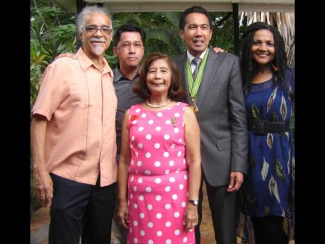 From left: Tommy Cowan, Randy Chin, Miss Pat , Chris Chin and Carlene Davis at a reception in honour of Chris Chin held at Hope Gardens.