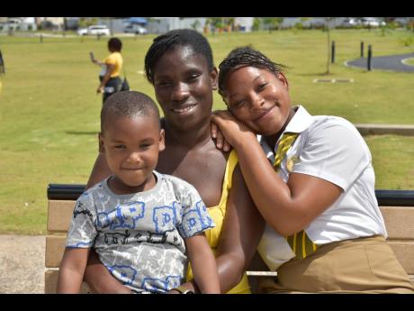 Otisa Wilmoth (right) and her son Adrian enjoy a moment with mom Vanisha Brooks