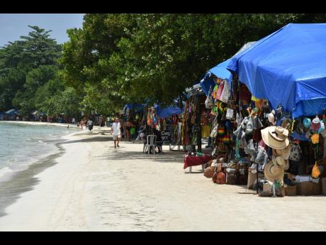 
Vendors plying their wares along the section of Seven-Mile Beach in Negril known as Bloody Bay.