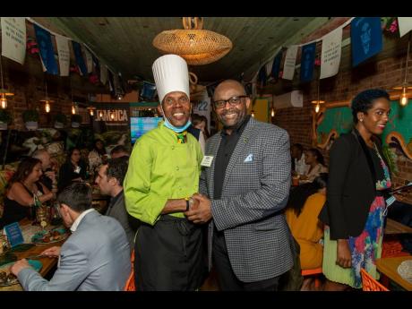 Jamaican born Basil Jones, head chef, Jasmine’s Caribbean Cuisine (left) poses with Director of Tourism, Donovan White. 