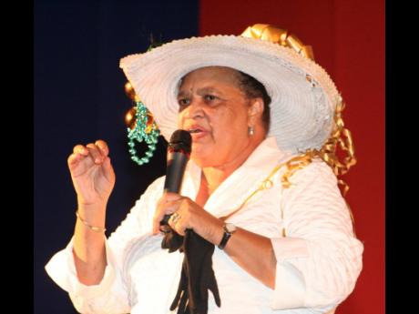 Barbara Gloudon performs in '876 Palaver' at the Grand Commemoration Concert & Pelican Awards of the University of The West Indies (UWI), Mona.