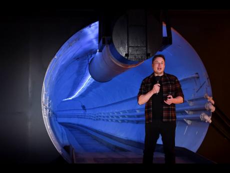 Elon Musk, co-founder and chief executive officer of Tesla Inc., speaks during an unveiling event for the Boring Company’s test tunnel in Hawthorne, California on December 18, 2018. 