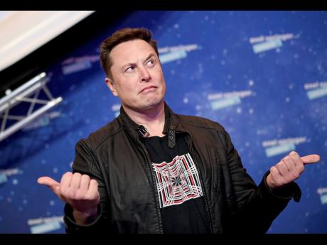 AP
SpaceX owner and Tesla CEO Elon Musk arrives on the red carpet for the Axel Springer media award in Berlin, Germany, on Tuesday, December 1, 2020. Many people are puzzled about what a Elon Musk takeover of Twitter would mean for the company, and even wh