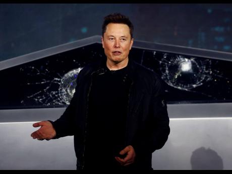 Tesla CEO Elon Musk introduces the Cybertruck at Tesla’s design studio in Hawthorne, California, on November 21, 2019.