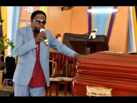 Judge Diamond  gives a musical tribute during the thanksgiving service for the life of his friend Fitzroy ‘Bunny Diamond’ Simpson. 