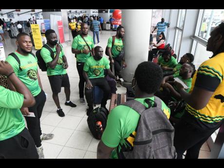 Members of Jamaica's Rugby League team gather after being stranded at the Norman Manley International Airport as flights were cancelled because of labour unrest by air traffic controllers on Thursday. 