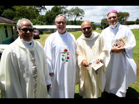 Monsignor Gregory Ramkissoon, (second right) with from left: Father Xavier Kannickarry, Father Peter McIsaac and Reverend Charles Dufour at his 70th birthday anniversary mass of thanksgiving at Sacred Hearts of Jesus and Mary Chapel Jacob’s Ladder in Mon