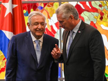 
President of Mexico Andrés Manuel López Obrador (left) and President of Cuba Miguel Diaz Canel chat after signing bilateral agreements at Revolution Palace in Havana, Cuba on May 8, 2022.
