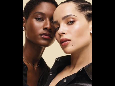 
Martinican SAINT stunner Aurelie Giraud (right) appears for YSL Beauty’s Touche Eclat illuminating pen alongside American actress Zoe Kravitz.