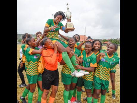 
Excelsior High School Girls’ football team celebrate winning the TipFriendly Society School Girl Football competition after a 3-0 win over Garvey Maceo High School at Ashenheim Stadium, Hope Road, St Andrew, on Friday.