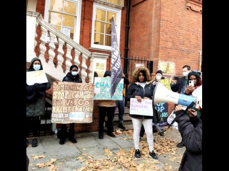 Movement for Justice placard-bearers demonstrate outside the Jamaican High Commission in London last year, calling for a mass deportation flight to be halted.