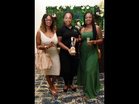 From left: Kiesha Wignall is excited to be celebrating the renewal of her vows. She is joined by brand ambassador Avagail Robinson of Select Brands with a bottle of bubbly and her friend, Marcine McLeish.