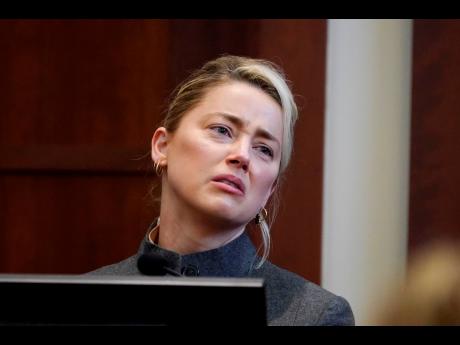 Amber Heard testifies in the courtroom at the Fairfax County Circuit Courthouse in Fairfax, Vancouver, on Monday.
