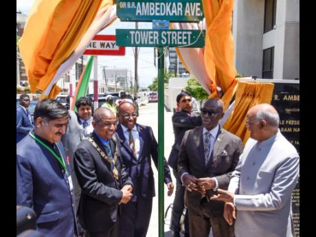 Ram Nath Kovind (right), president of India, and Satish Gautama (left), member of parliament for Aligarth in India, participate in Monday's renaming of a section of Tower Street in honour of late civil-rights lobbyist Dr Bhimrao Ambedkar. Sharing in the mo
