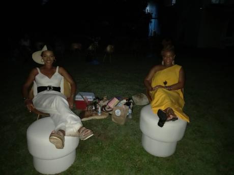 Prepared for ‘Dinner And A Movie Under The Stars’ were sisters (from left) Angelie Martin-Spencer and Allison Spence.