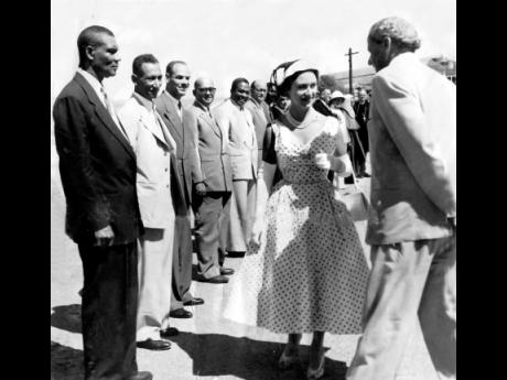 
In this 1955 photograph Princess Margaret stops for a chat with Norman Manley, chief minister, when members of executive council were presented at Port Royal. The executive councillors waiting to be presented are (from left) A.G.S. Coombs, Claude Stuart, 