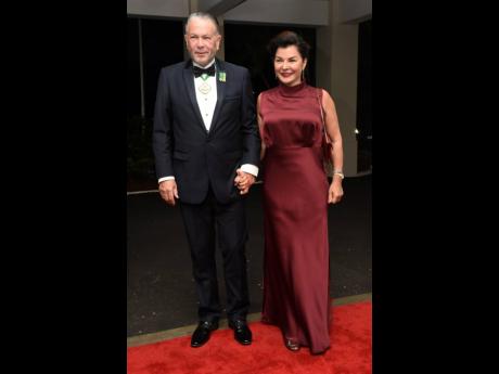 Tom Tavares-Finson, president of the senate, with his wife Rose who was donning a Le Trunkshop find which went seamlessly with her Salvatore Ferragamo handbag and shoes.