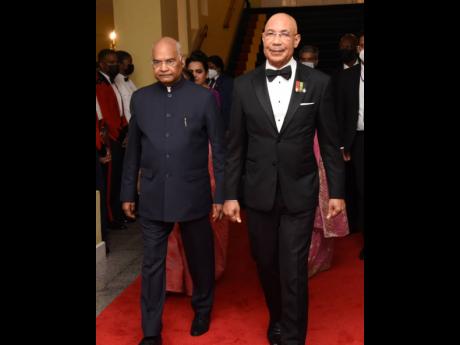 Governor General of Jamaica, Sir Patrick Allen (right) was dapper in a tuxedo as he escorted Ram Nath Kovind, president of India to the ball room.
